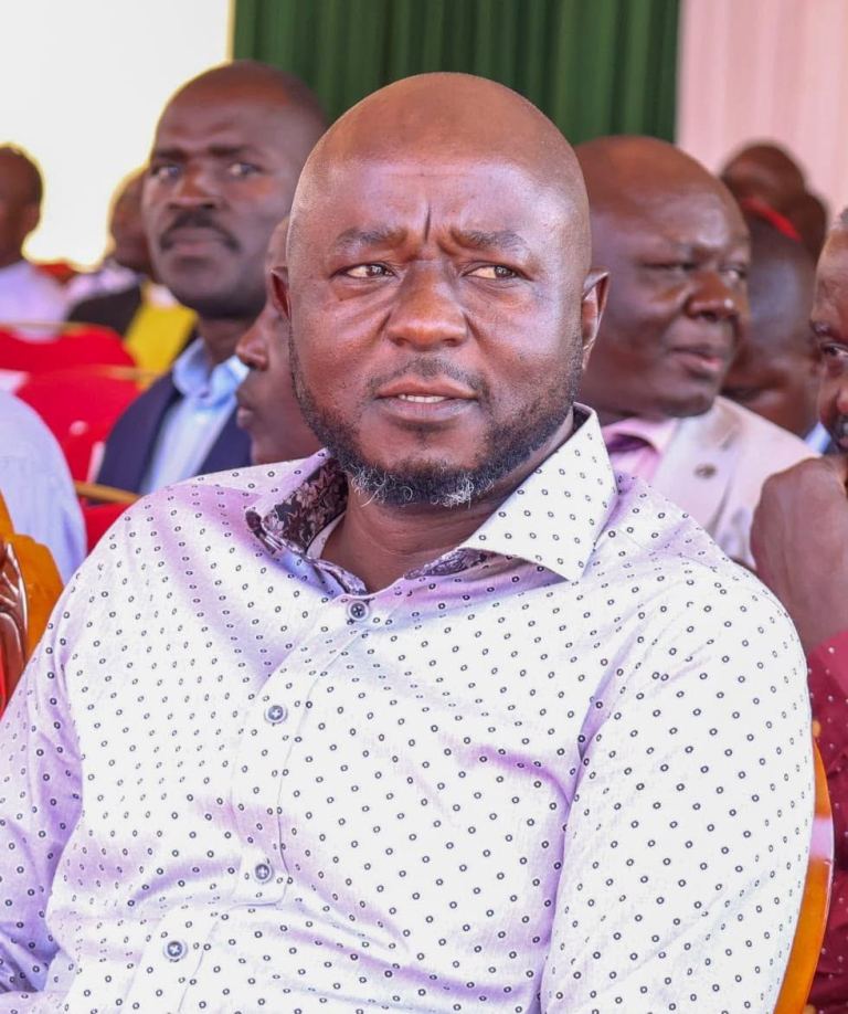 Mark Nyamita seated among guests at a public meeting